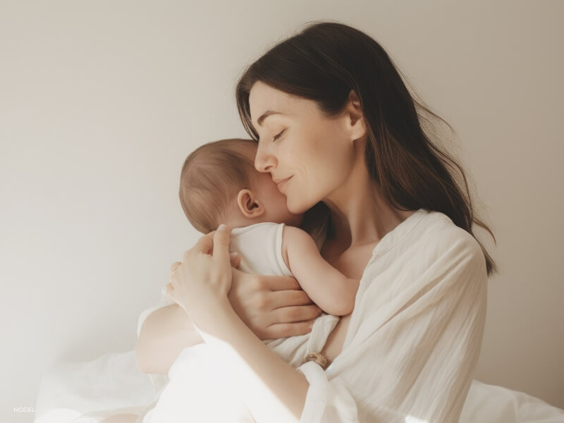 Mother with newborn taking time to recover after giving birth
