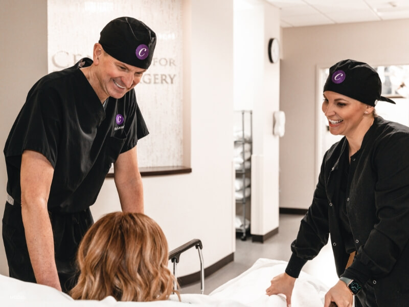 Mother with a board-certified plastic surgeon excited about postpartum options