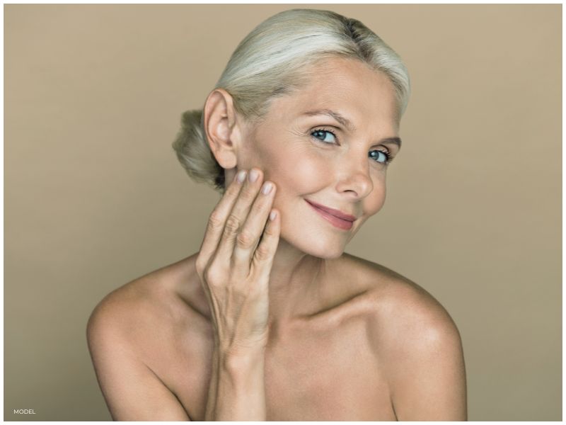 Stock Image of Woman Focused on Skin Quality and Chin Shape