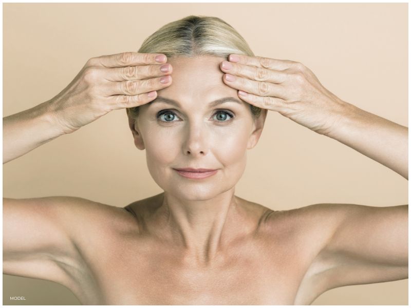 Stock Image Woman Focused on Eyes, Eyebrows, and Forehead