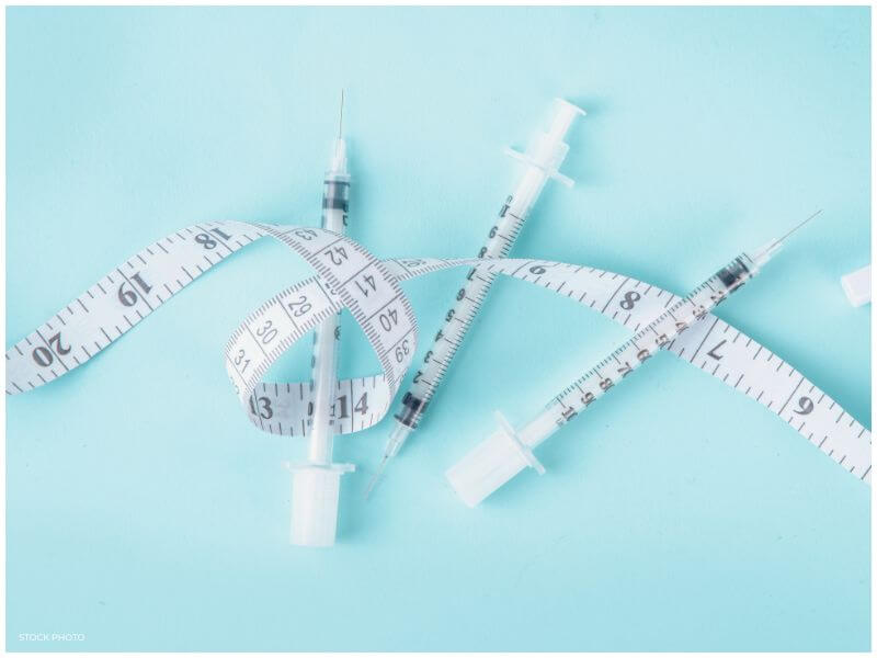 weight loss medication syringes with measuring tape